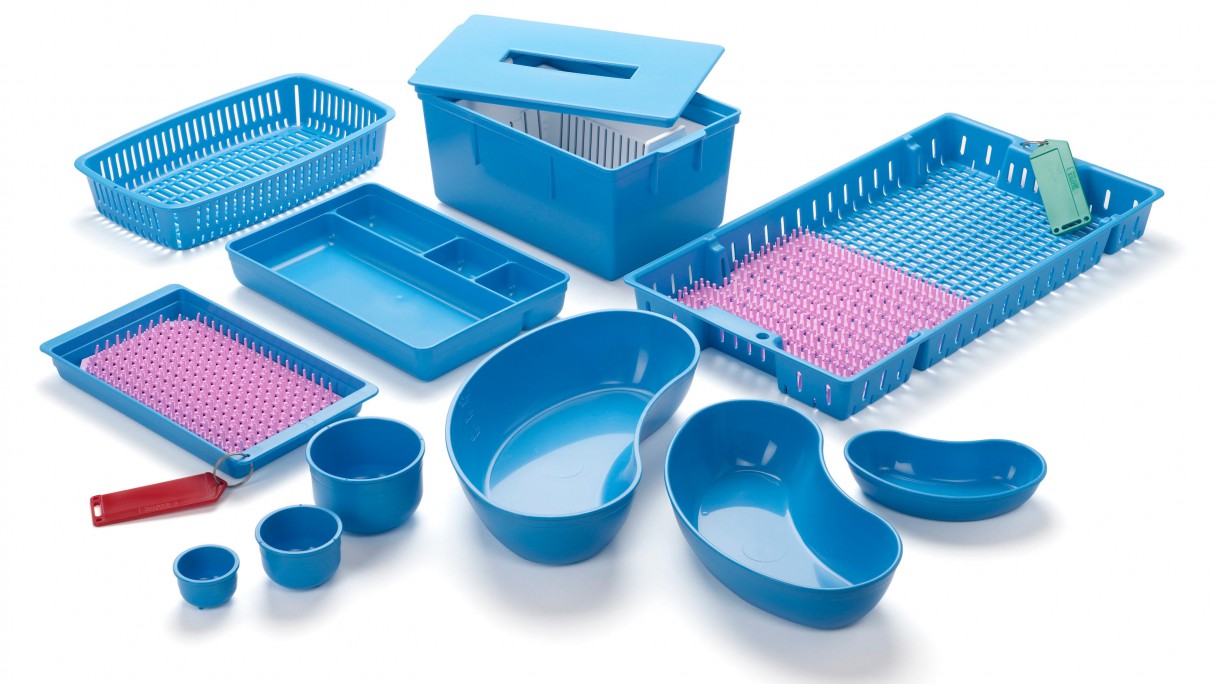 Assorted blue plastic medical sterilization trays, bowls, and kidney dishes for healthcare use