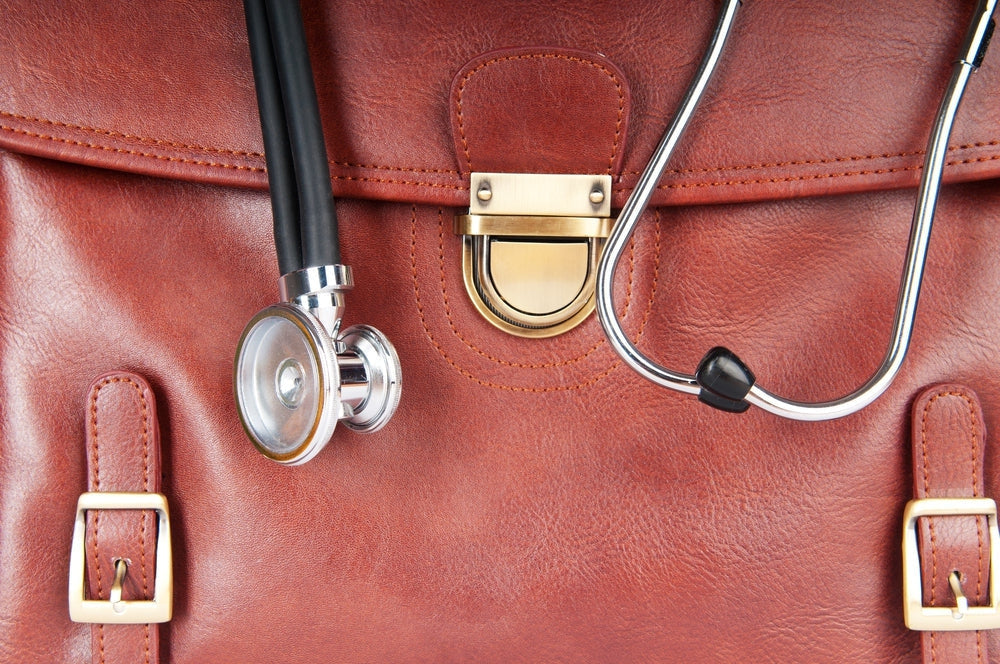Medical leather doctor's bag with stethoscope, healthcare and medical supplies concept
