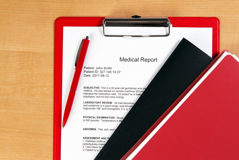 Medical report on clipboard with pen and folders, ideal for healthcare office accessories