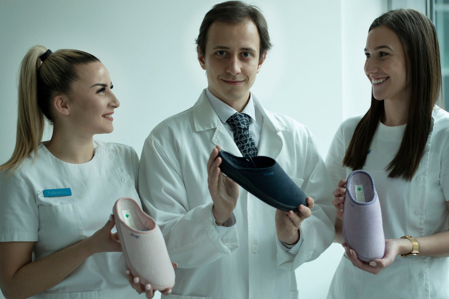Medical professionals showcasing comfortable healthcare footwear clogs in clinical setting