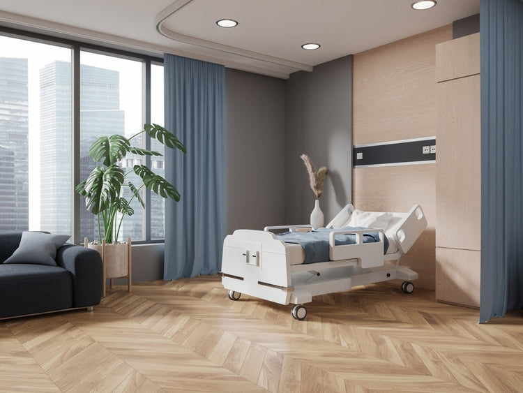 Modern hospital room with adjustable medical bed, large windows, and contemporary furnishings