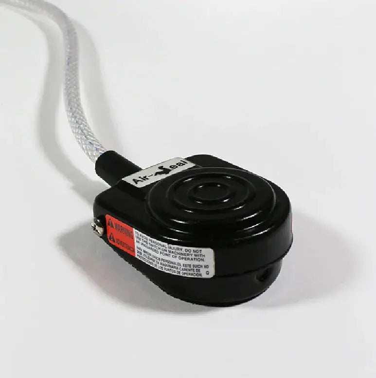Black medical footswitch with textured hose, labeled Air-Seal, on white background