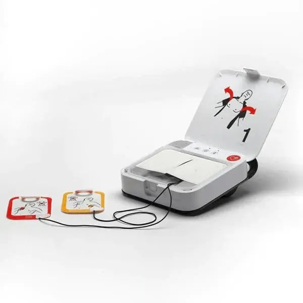 Semi-automatic defibrillator with open lid, showing electrode pads and illustrated instructions